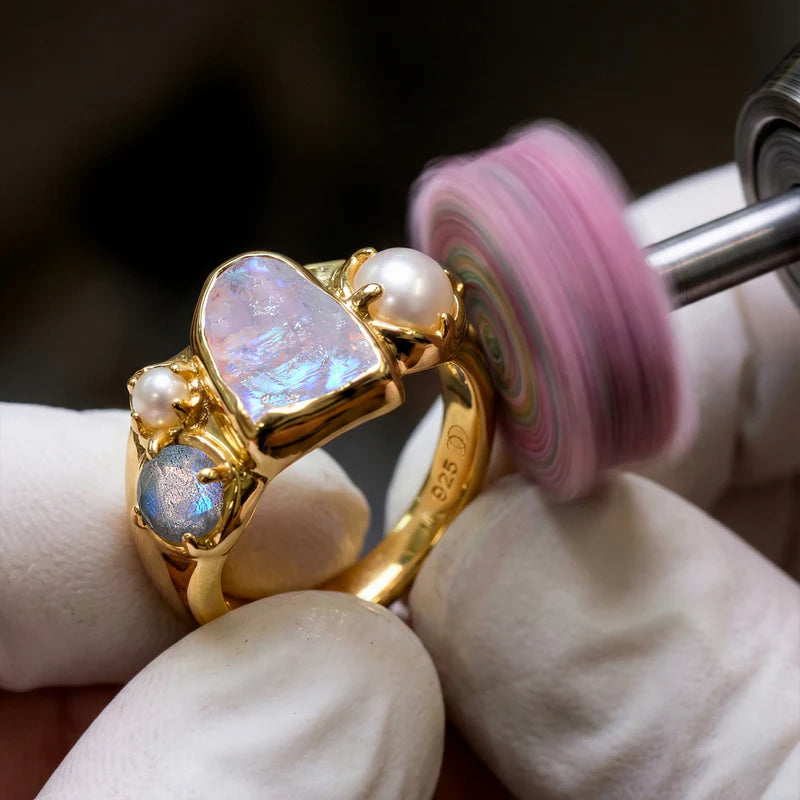 Craftsperson polishing ring